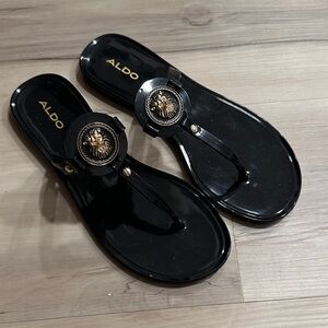 ALDO Gannaelden Black Jelly Thong Sandals with Gold Medallion Accent